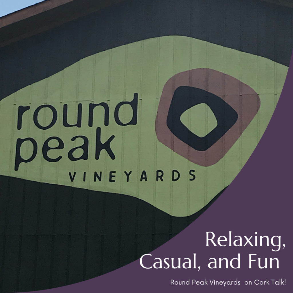 A picture of the Round Peak Vineyards logo on the tasting room at the winery.